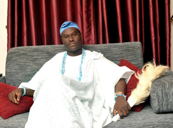 black american sitting on a couch